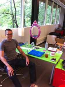 Matt coming back from vacation to a decorated desk, including introduction of the "Princess Mirror" to New Kind.
